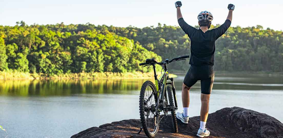 mountain biker infront of beautiful lake